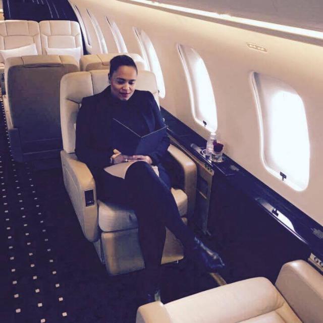 Marina Guilleux, Founder of Private 6, working aboard a private aircraft — luxury experience practice operating across London, Paris, and internationally